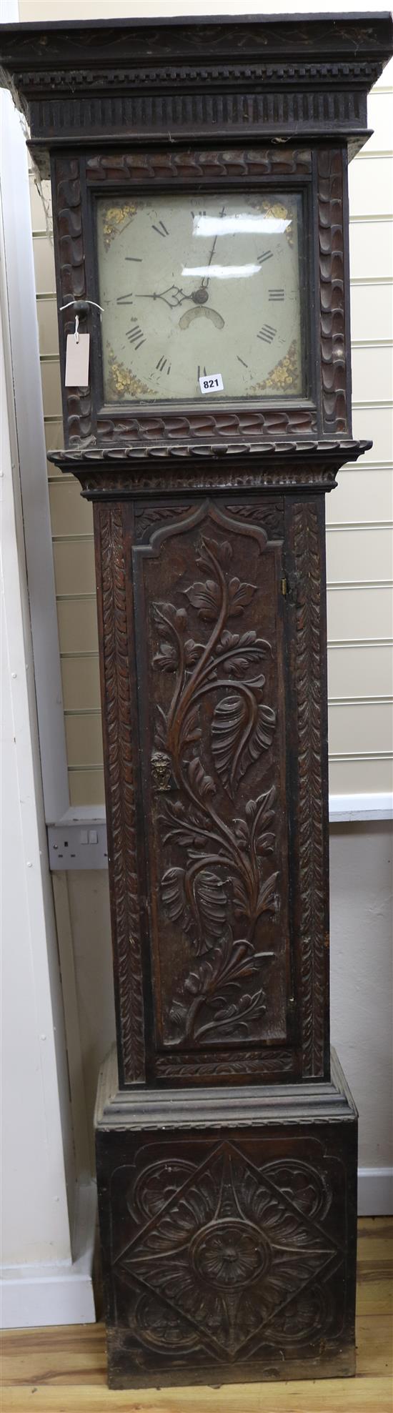 A carved oak thirty hour longcase clock with painted dial, 205cm